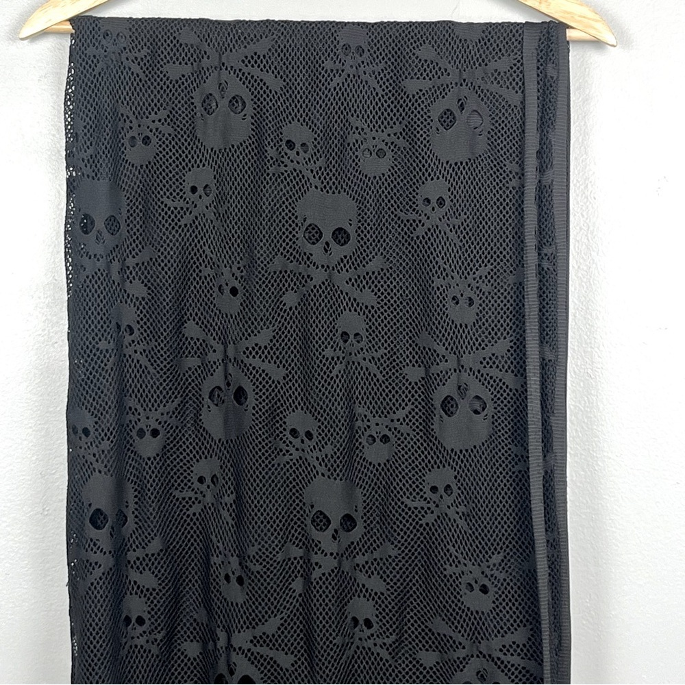Skull print black woven mesh fabric piece, approx. 70” x 74”.